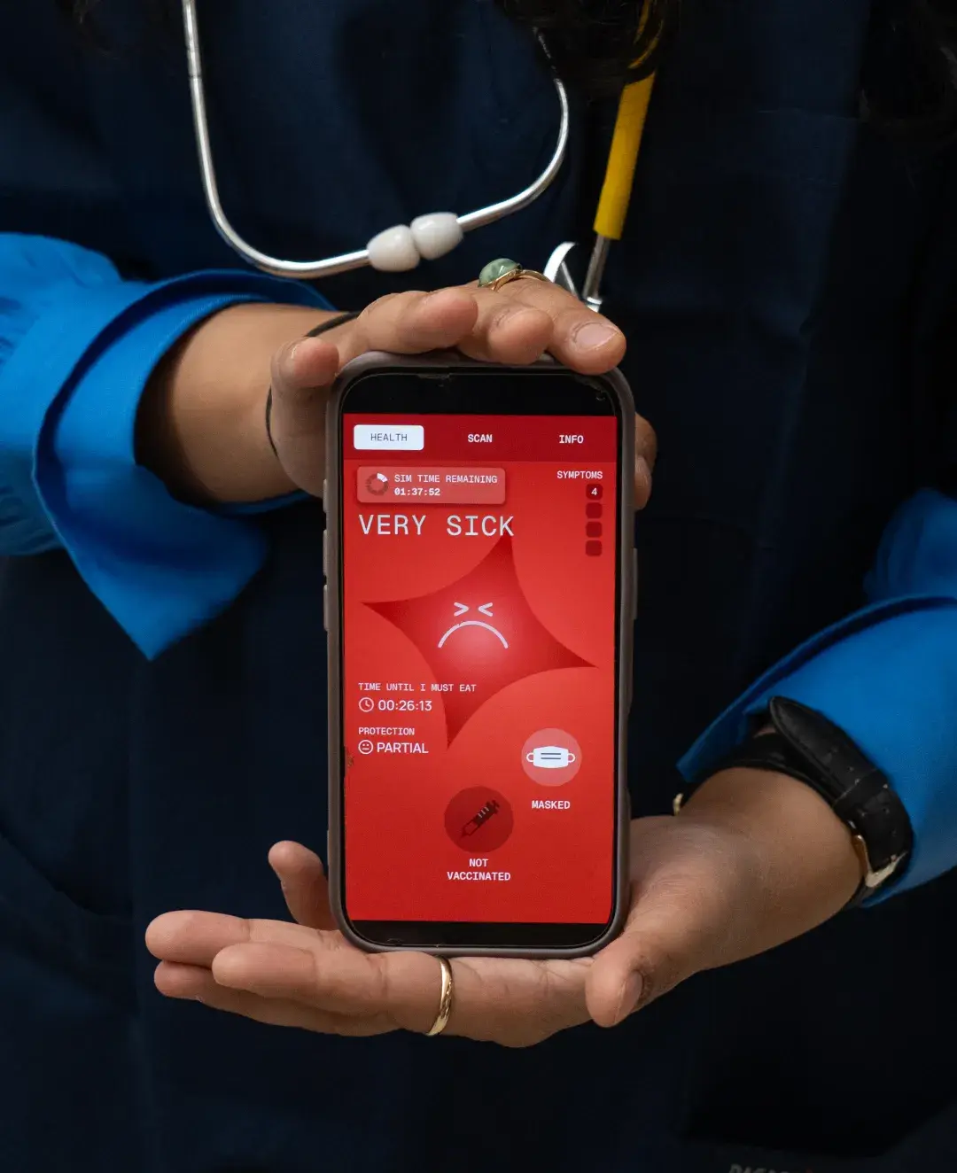 A person in a blue medical uniform and stethoscope holds a smartphone displaying the Operation Outbreak app, showing a red screen with a sad face icon, "VERY SICK," and health status indicators.